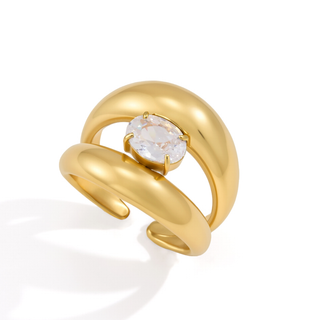 Gold ring with a diamond on a white background