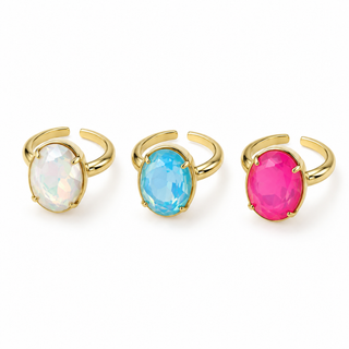 Three gold rings with colorful gemstones on a white background