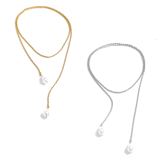 Two delicate rope-chain necklaces with white teardrop shell pendants, shown side by side on a plain white background. One necklace is gold-toned and the other is silver-toned.