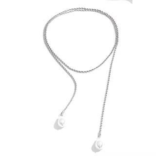 A silver-toned twisted chain necklace with two dangling pearl-like oval charms, photographed on a plain white background.