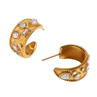 Gold hoop earrings with embedded pearls and crystals on a white background