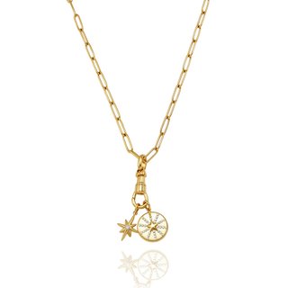 Celeste Starburst Necklace gold paperclip chain with star charm and crystal-accented starburst pendant