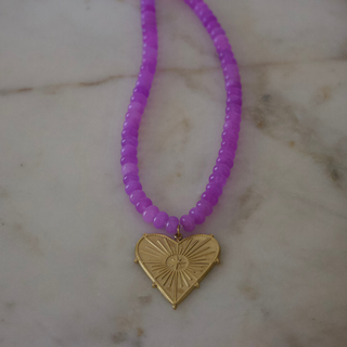 Stella Heart Gemstone Necklace with purple beads and gold heart pendant with starburst design