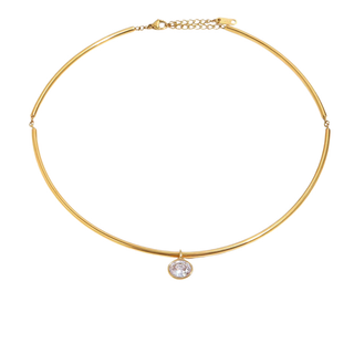 A delicate gold bangle necklace with a single bezel-set clear oval gemstone pendant, displayed on a clean white background.