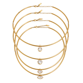 Five stacked gold bangle necklaces with graduated oval and marquise-cut clear gemstones, displayed on a clean white background.