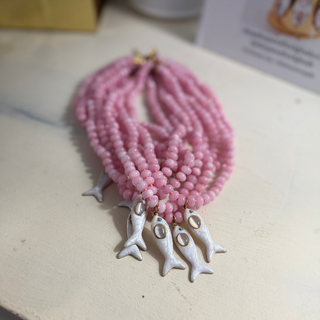 Maris Fish Beaded Necklace pink beads with white fish charm and gold accents