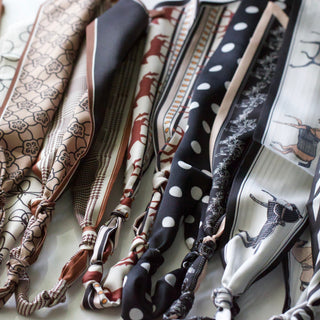 Collection of patterned hair ties on a white background