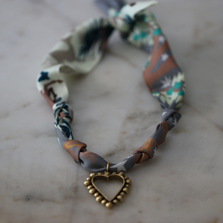 Beaded Heart Scarf Necklace with a twisted multicoloured printed fabric band and gold-tone beaded heart pendant