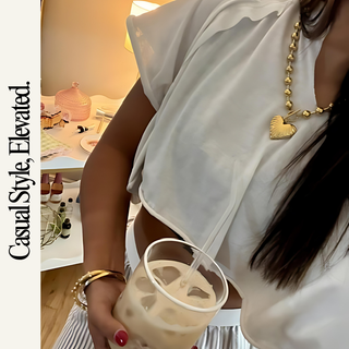 Beaded Heart Statement Necklace in gold-tone metal, featuring a chunky beaded chain and a polished heart pendant.