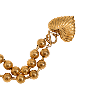 Beaded Heart Statement Necklace in polished gold-tone metal, with rounded beads and a sculpted fan-shaped clasp