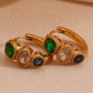 Bezel Trio Huggie Earrings in gold-tone metal with textured bezel settings and green, clear, and deep blue stones