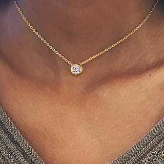 Bezeled CZ Pendant necklace with a fine gold-tone chain and round clear stone in a slim bezel setting
