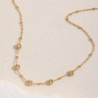Bezeled Lilylight Necklace with a delicate gold-tone chain and evenly spaced round clear stones in raised bezels.
