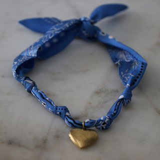 Blue Skies Heart Locket scarf necklace in blue patterned fabric with a small gold-tone heart-shaped pendant