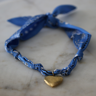 Blue Skies Heart Locket scarf necklace in blue patterned fabric with a small gold-tone heart pendant