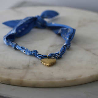 Blue Skies Heart Locket scarf necklace in blue patterned fabric with a small gold-tone heart pendant