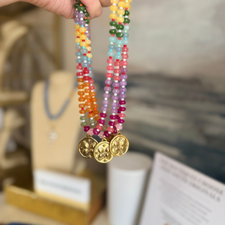 Butterfly Kisses Beaded Necklace with glossy multicolor round beads and three small gold-tone butterfly medallions