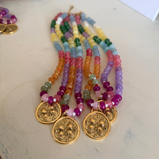 Butterfly Kisses Beaded Necklace with glossy multicolor round beads and round gold-tone medallion pendants