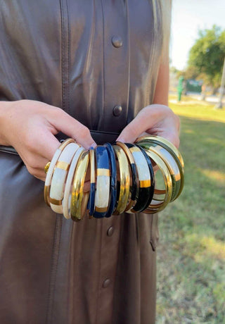 Camille Resin Bangle Set with cream, navy, black, and green glossy resin bangles and polished gold-tone accents
