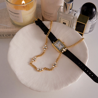 Cannes triple Baguette CZ necklace in gold-tone chain with three clear baguette crystal clusters and a clasp detail