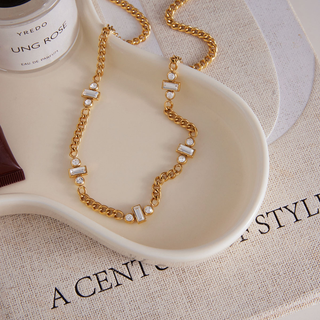 Cannes triple Baguette CZ necklace in gold-tone curb chain with repeating rectangular baguette and round clear stones