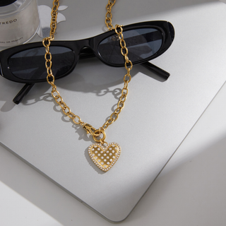 Clara Heart Clasp Necklace with a chunky gold chain and textured pavé heart pendant set with sparkling stones