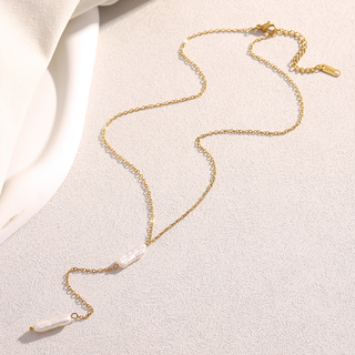 Delicate Drop Pearl Lariat Necklace in gold-tone metal with a fine chain and two elongated white pearl drops