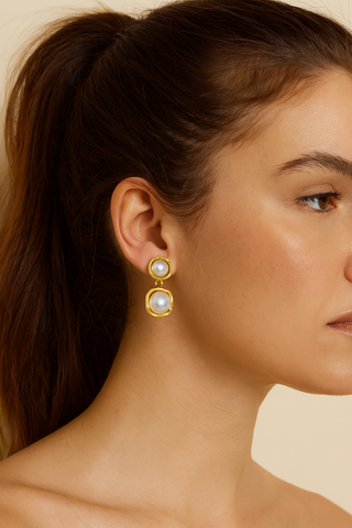 Double Pearl Drop Earrings in gold-tone metal, each featuring two round white pearls linked in a simple drop design