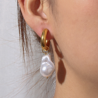 Drift Pearl Earrings with a polished gold hoop and lustrous white pearl in an irregular organic shape