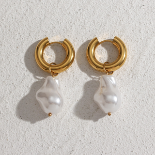 Drift Pearl Earrings with chunky gold-tone hoops and irregular white faux baroque pearls, each with a tiny gold bead