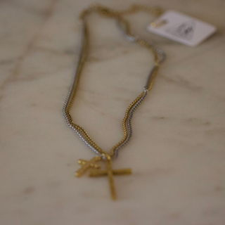 Dual Cross Necklace with a gold-tone chain and two layered crosses, including a slim silver-tone cross accent