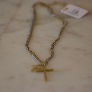 Dual Cross Necklace with a gold-tone chain and two overlapping cross pendants in a mixed-metal finish