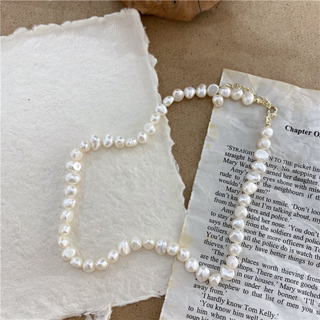 Eden Pearl Necklace with irregular ivory faux freshwater pearls and a delicate gold-tone chain clasp