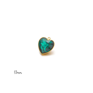 Emerald Green Heart Charm with a faceted emerald-green heart stone in a polished gold-tone bezel and hanging loop