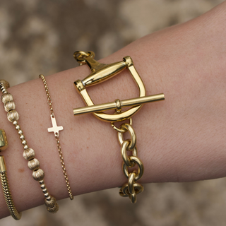 Equestrian Horse Bit toggle bracelet in polished gold-tone metal, featuring a chunky chain and equestrian clasp