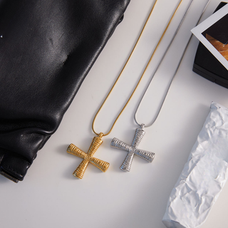 Etched Long Cross Necklace with gold and silver finishes, featuring ribbed dimensional cross pendants on slim chains