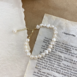 Faux Pearl Bracelet 18k Gold Non Tarnish with irregular white pearls and a delicate gold-tone chain extender and clasp.
