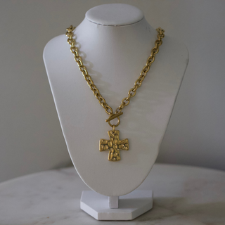 Hammered Cross Toggle necklace in gold-tone metal, featuring a chunky chain, textured cross pendant and toggle clasp.
