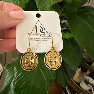Heritage Cross Earrings with antique gold-tone oval dangles, each featuring a raised cross motif and textured finish