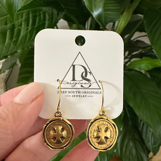Heritage Cross Earrings with round antique gold-toned dangles, each featuring a raised cross motif and textured rim