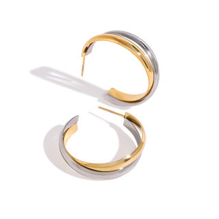 Luna Hoops are polished gold and silver two-tone open hoop earrings with rounded bands and slim post closures.