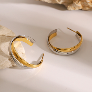 Luna Hoops are polished two-tone gold and silver stainless steel earrings with a bold, open hoop design