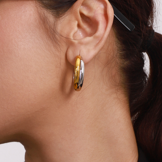 Luna Hoops two-tone gold and silver polished hoops with a smooth, rounded shape and reflective finish