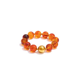 Mila Beaded Bracelet with translucent orange and amber resin beads, a gold-tone center bead and gold accents
