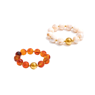 Mila Beaded Bracelet with glossy white and amber-orange resin beads, gold-tone spacers and a round gold accent bead