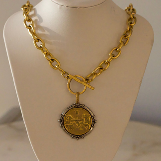 Neptune Coin Necklace with an antique gold coin pendant, dark engraved detailing and a chunky gold link chain