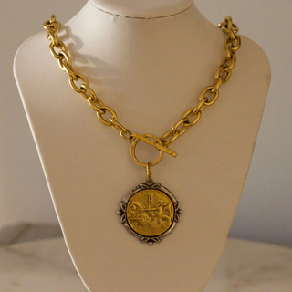 Neptune Coin Necklace in gold-tone metal with chunky oval links, toggle clasp and round engraved coin pendant