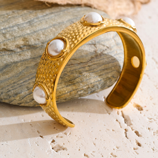 Pearl Ivy Cuff Bracelet in textured gold-tone metal with raised white pearl accents and an open sculptural design