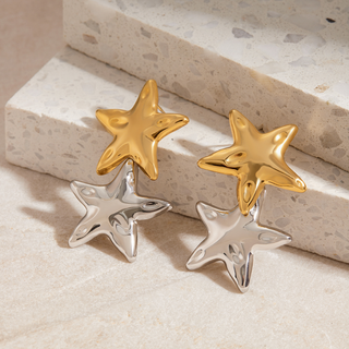 Riviera Star Earrings with polished gold and silver star charms in a shiny mixed-metal design