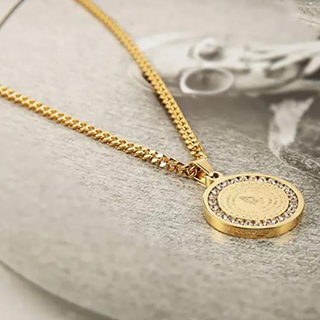 Serenity Prayer Pendant in gold-tone metal with a round engraved medallion and a border of clear sparkling stones on a chain